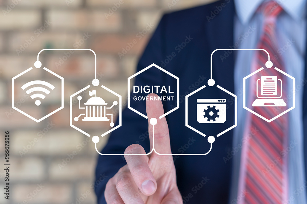 Businessman using virtual touch screen presses text: DIGITAL GOVERNMENT. Electronic government concept. Modern governance technologies. Digitalization. Digital transformation public government sector.
