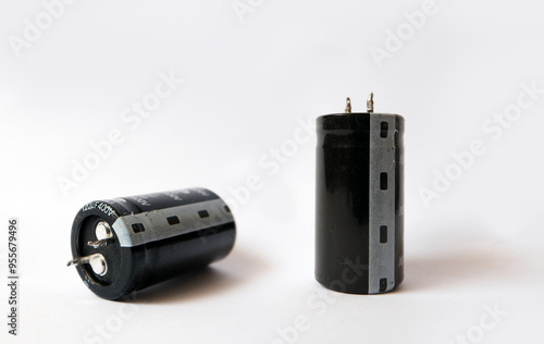 Capacitors on a white background. 120 microfarad 400 Volts capacitor. photo