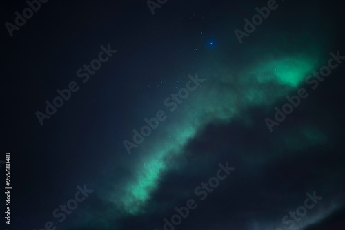 Blue and Green Northern lights  with stars and clouds in Norway