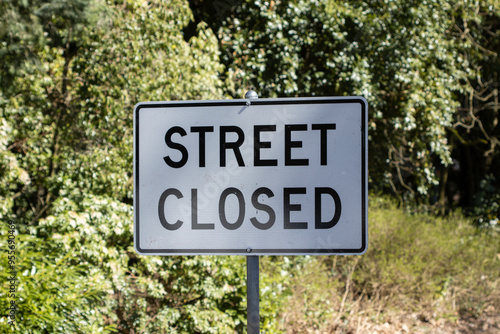 Street Closed signage on a suburban neighborhood road.
