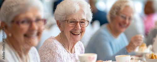 Seniors attending a tea party, elegant setting, socializing and enjoying refreshments