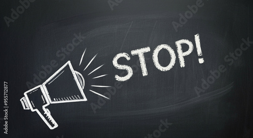 Megaphone with stop sign emitting sound on chalkboard background