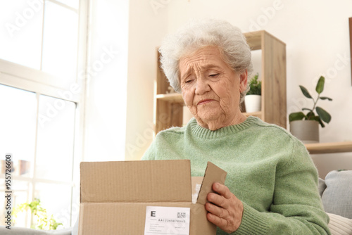 Upset senior woman opening ...