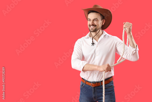Handsome cowboy with lasso ...