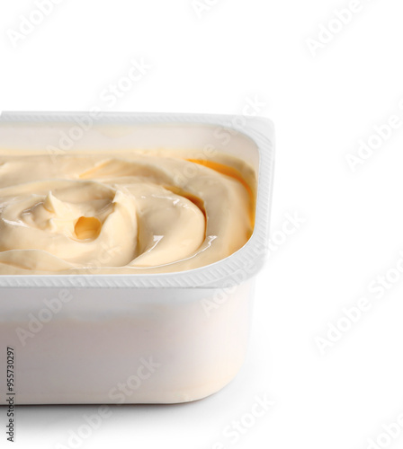 Plastic container with tasty cream cheese on white background