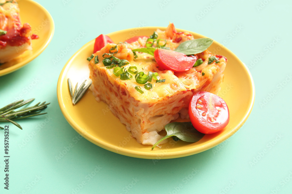 Plate of pasta with tomato sauce and cheese on turquoise background Plate of pasta with tomato sauce and cheese on turquoise background
