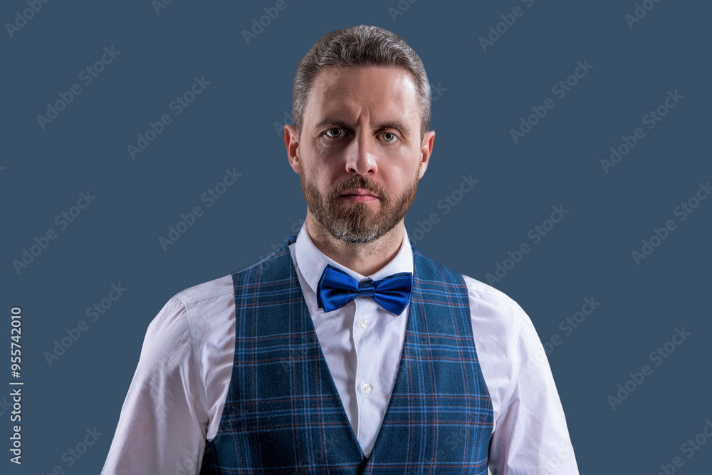 Waitstaff. Tuxedo man in menswear isolated on grey. Charismatic man in formal menswear. Handsome waiter man wear tuxedo. Elegant tuxedo bowtie. Waiter in bowtie ready to serve Waitstaff. Tuxedo man in menswear isolated on grey. Charismatic man in formal menswear. Handsome waiter man wear tuxedo. Elegant tuxedo bowtie. Waiter in bowtie ready to serve