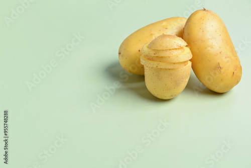 Fresh raw potatoes, one par...