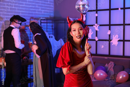Young Asian woman in costum...