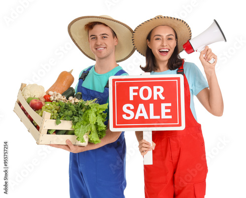 Young farmers with vegetabl...