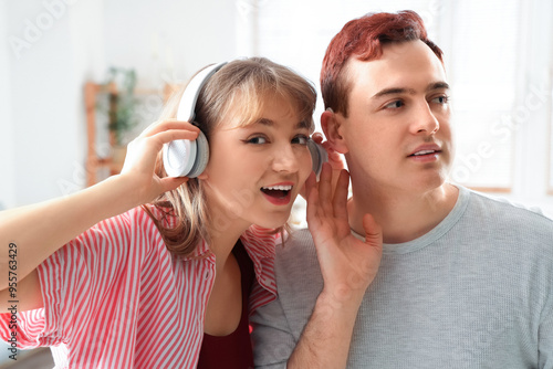 Young man with hearing aid ...