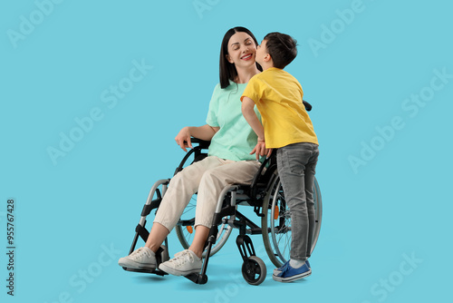 Little boy kissing his moth...