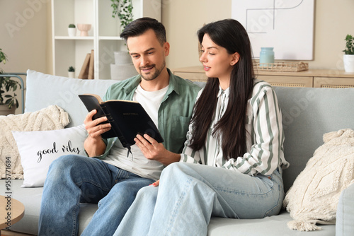 Religious couple reading Ho...