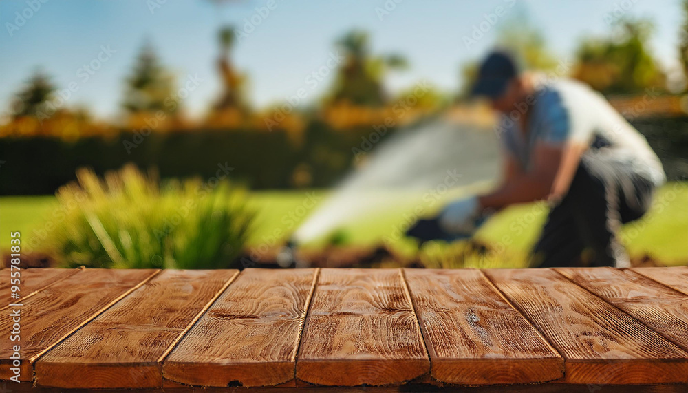 Plants Irrigation System.empty table with blurred background of a man installing irrigation system in parks and gardens
Plants Irrigation System.empty table with blurred background of a man installing irrigation system in parks and gardens
