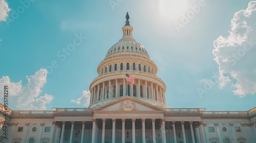 The U.S. Capitol building against a bright blue sky with fluffy clouds.