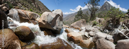 Panoramic view of rocky river landscape with mountains photo