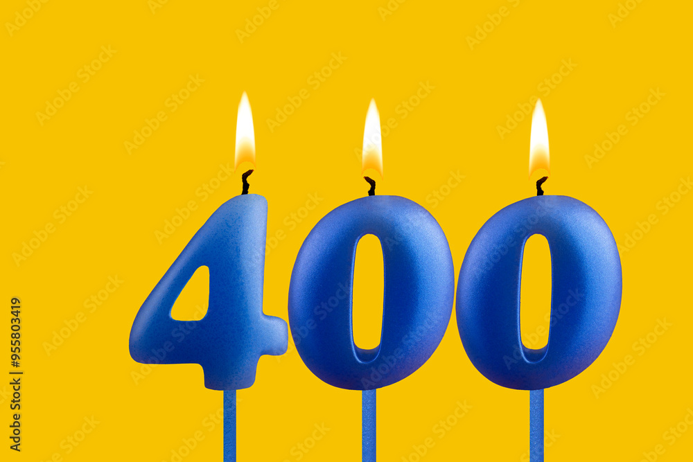 Blue candle number 400 - Birthday on yellow background Blue candle number 400 - Birthday on yellow background