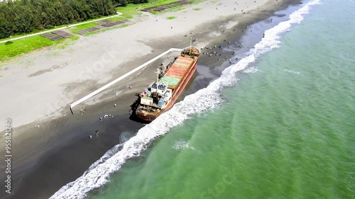 Sophia Cargo Ship stranded on the Golden Coast beach at Tainan City, Taiwan  photo