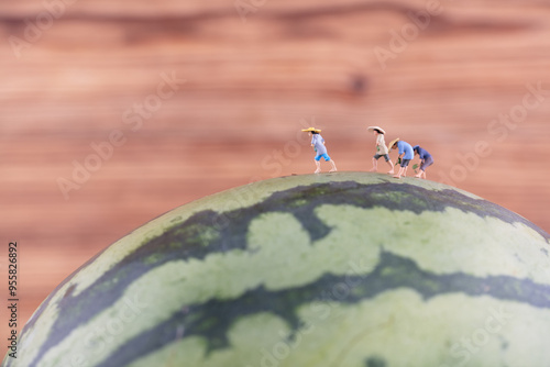 Farmer on watermelon in miniature scene