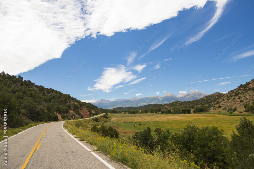 Two-lane Colorado highway with mountains background Two-lane Colorado highway with mountains background