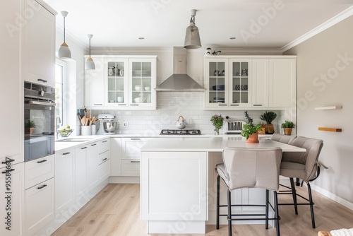 Minimal white kitchen with cozy seating and elegant design
