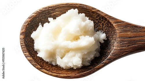 a dollop of coconut oil on a wooden spoon, rich and creamy, rustic and natural, isolated on white background photo