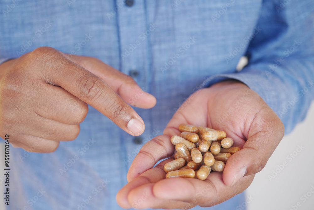 A Detailed CloseUp Image of Hands Grasping Natural Dietary Supplements for Health Benefits A Detailed CloseUp Image of Hands Grasping Natural Dietary Supplements for Health Benefits