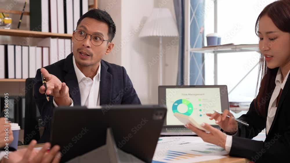Group of business people discussing brainstorming and working with laptops and marketing analytics documents in conference room about financial strategies. Group of business people discussing brainstorming and working with laptops and marketing analytics documents in conference room about financial strategies.