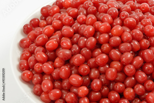 Close-up of stacked red oleaster(Elaeagnus typica) fruits on whihe dish, South Korea photo