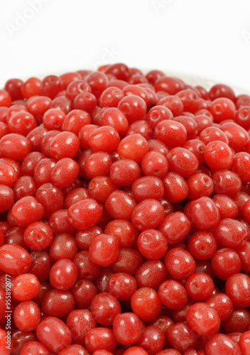 Close-up of stacked red oleaster(Elaeagnus typica) fruits against white background, South Korea