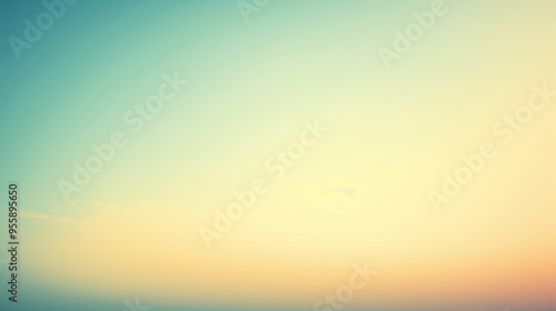 Tranquil gradient sky at sunrise with soft pastel hues of blue and orange