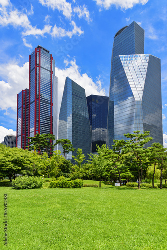 Yeouido, Yeongdeungpo-gu, Seoul, South Korea - July 18, 2021: Summer view of Yeouido Park against highrise buildings of financial district