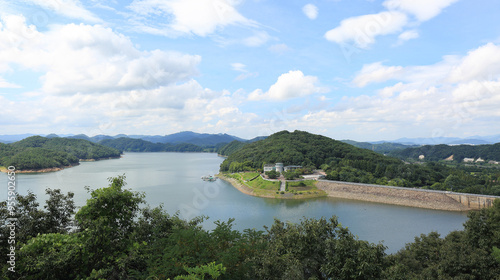 Daedeok-gu, Daejeon, South Korea - July 17, 2021: High angle view of Water Culture Center and Daecheong Dam of Daecheong Lake in summer photo