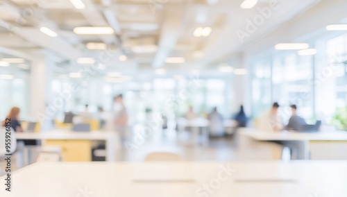 Blurred office interior with people working, featuring a modern white and light blue color scheme with yellow accents. Ideal for a business concept banner, with soft lighting and a clean, contemporary