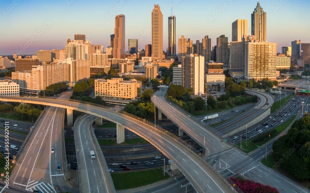 Downtown city skyline of Atlanta and morning rushhour traffic on the freeway at sunrise, Georgia, United States. Downtown city skyline of Atlanta and morning rushhour traffic on the freeway at sunrise, Georgia, United States.