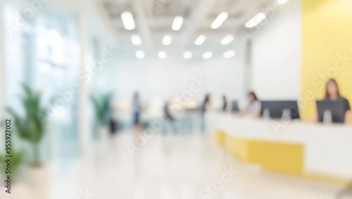 Blurred office interior with people working, featuring a modern white and light blue color scheme with yellow accents. Ideal for a business concept banner, with soft lighting and a clean, contemporary