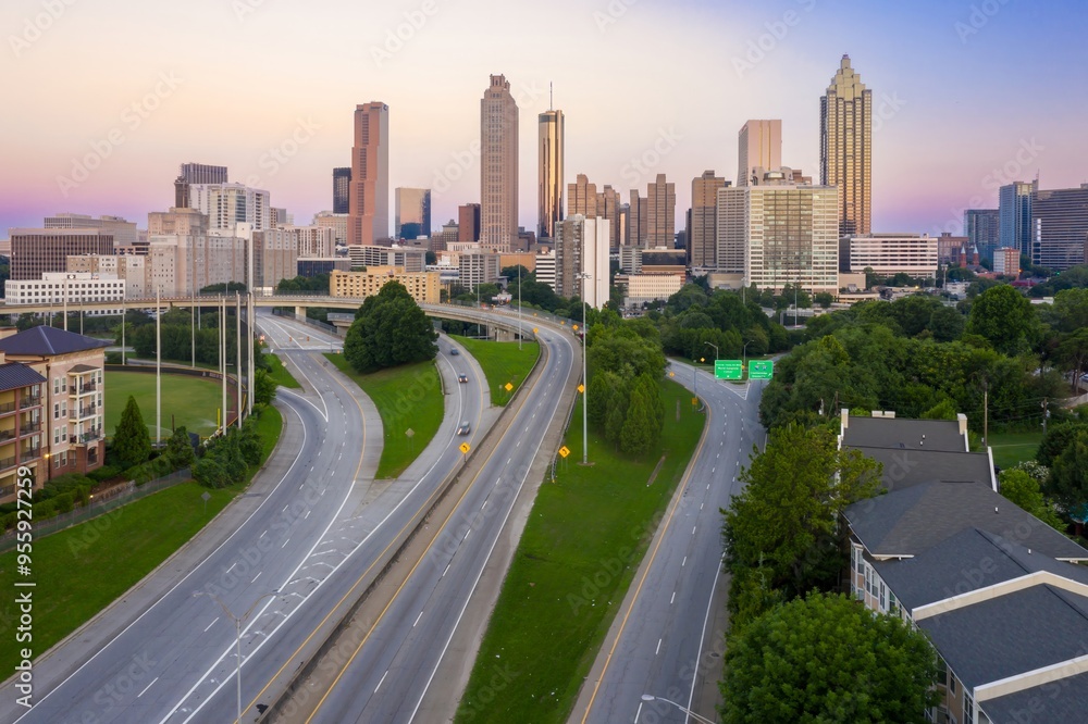 Downtown city skyline of Atlanta and morning traffic on the freeway at sunrise, Georgia, United States. Downtown city skyline of Atlanta and morning traffic on the freeway at sunrise, Georgia, United States.