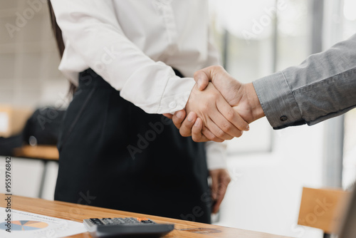 Wallpaper Mural Two Asian business People shaking hands and meeting in office, Business about successful startup projects concept. Torontodigital.ca