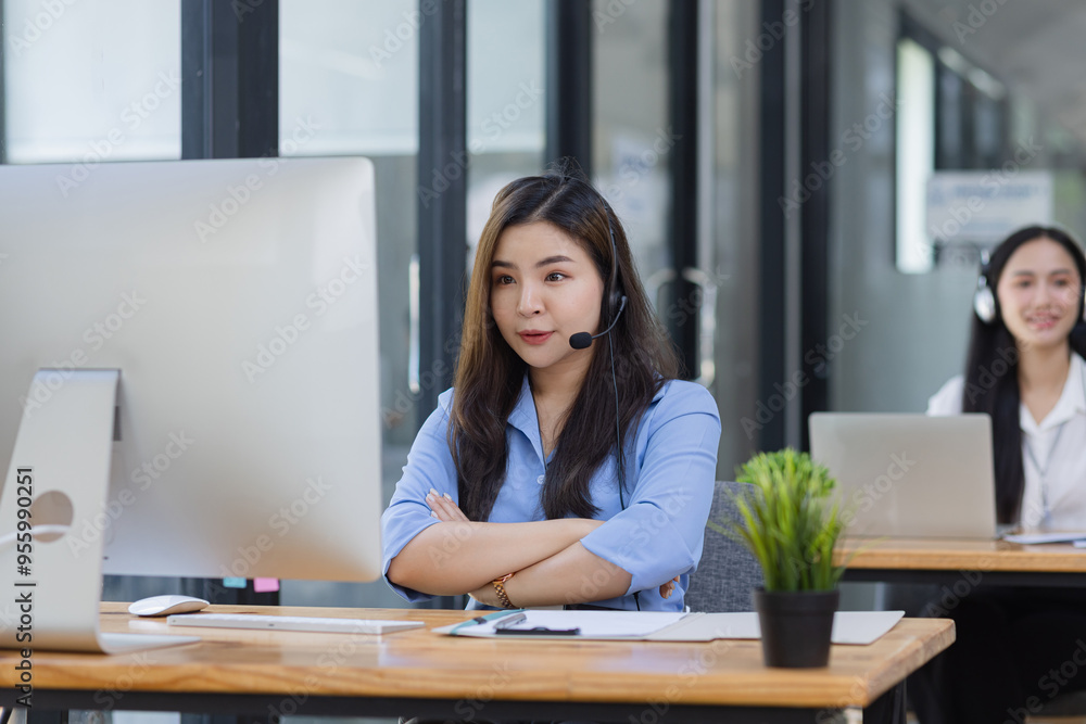 Young asian businesswoman with headset using desktop computer for customer support and online working in office, Call center helping for customers online concept. Young asian businesswoman with headset using desktop computer for customer support and online working in office, Call center helping for customers online concept.