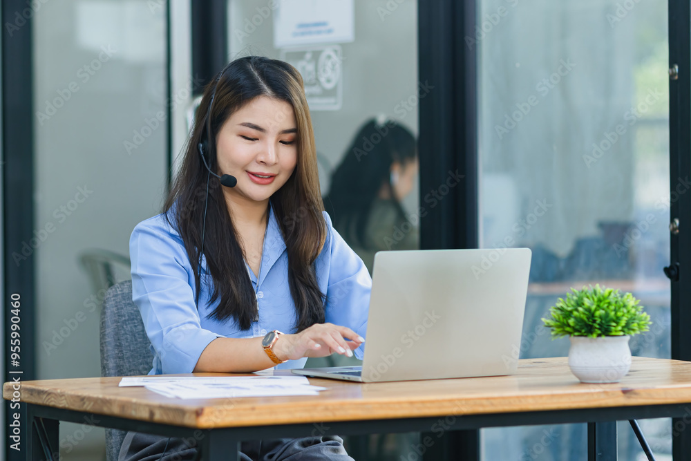 Young asian businesswoman with headset using desktop computer for customer support and online working in office, Call center helping for customers online concept. Young asian businesswoman with headset using desktop computer for customer support and online working in office, Call center helping for customers online concept.