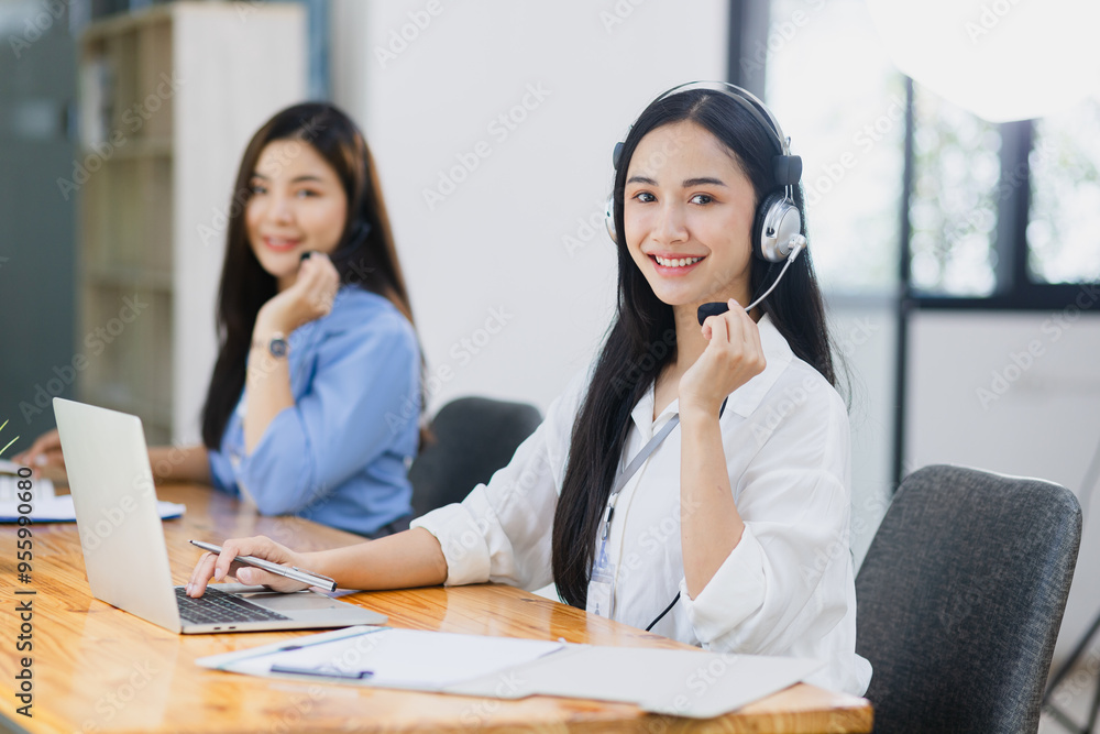 Young asian businesswoman with headset using desktop computer for customer support and online working in office, Call center helping for customers online concept. Young asian businesswoman with headset using desktop computer for customer support and online working in office, Call center helping for customers online concept.