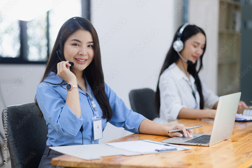 Young asian businesswoman with headset using desktop computer for customer support and online working in office, Call center helping for customers online concept. Young asian businesswoman with headset using desktop computer for customer support and online working in office, Call center helping for customers online concept.
