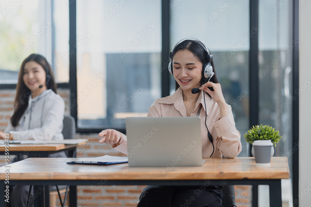 Young asian businesswoman with headset using desktop computer for customer support and online working in office, Call center helping for customers online concept. Young asian businesswoman with headset using desktop computer for customer support and online working in office, Call center helping for customers online concept.