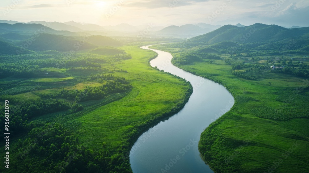 A serene river winding through a green landscape A serene river winding through a green landscape