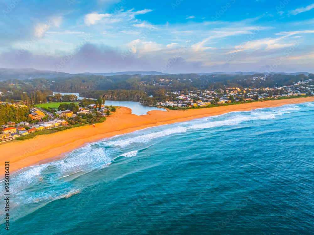 Fototapeta premium Aerial views of sunrise by the sea with clouds