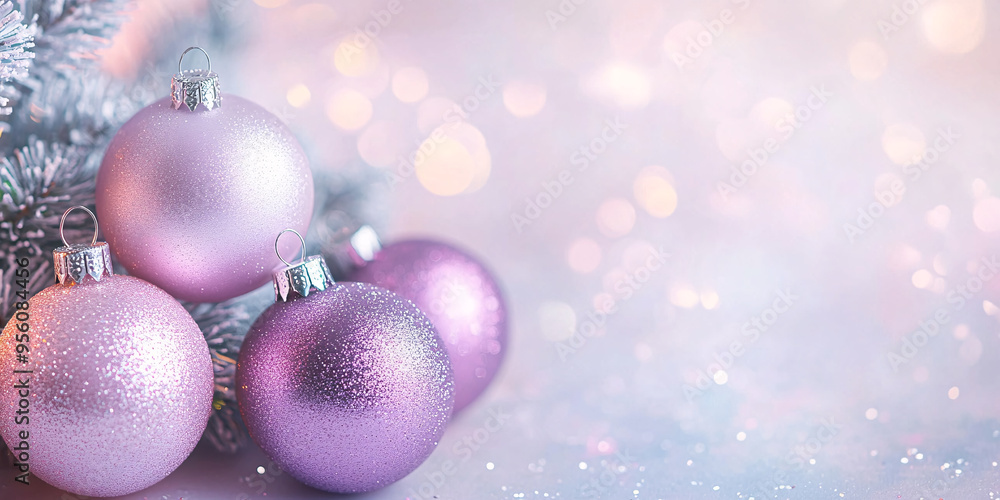 Fototapeta premium Christmas banner with pink and purple bauble ornaments with bokeh lights and copy space