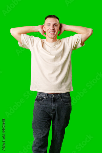 Man Reacting in Surprise With Hands on Head Against a Bright Green Background