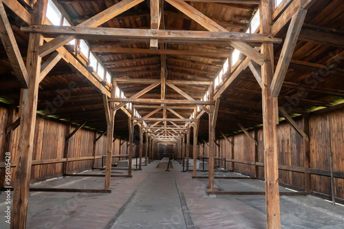 Wallpaper Mural Interior view of an empty wooden barn with structural beams and a high ceiling. Torontodigital.ca