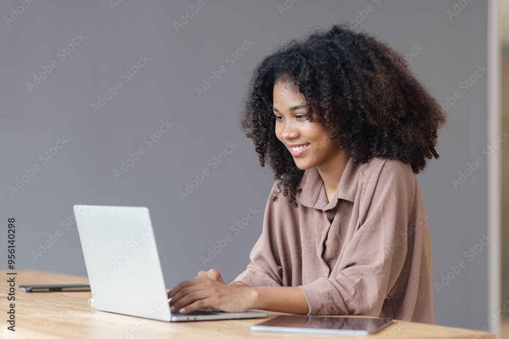 Excited African American woman with laptop. Excited African American woman with laptop.