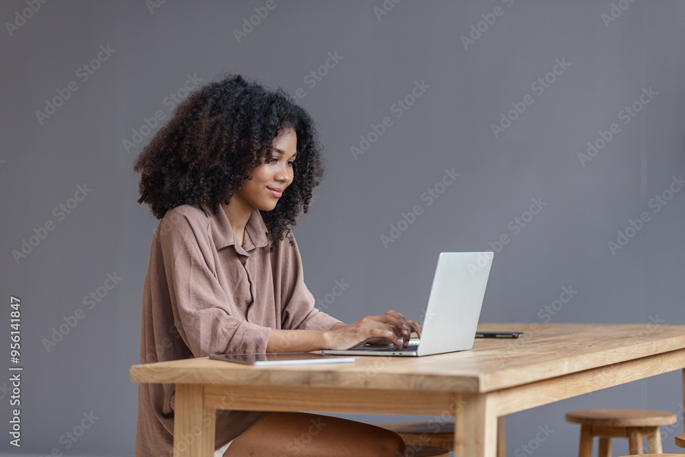 Excited African American woman with laptop. Excited African American woman with laptop.